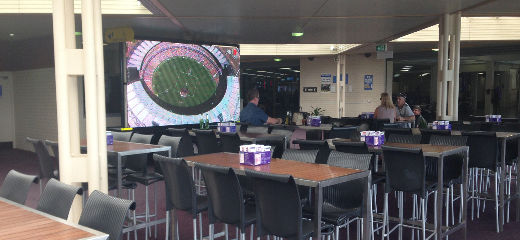 Football on a Mega Screen inside a pub