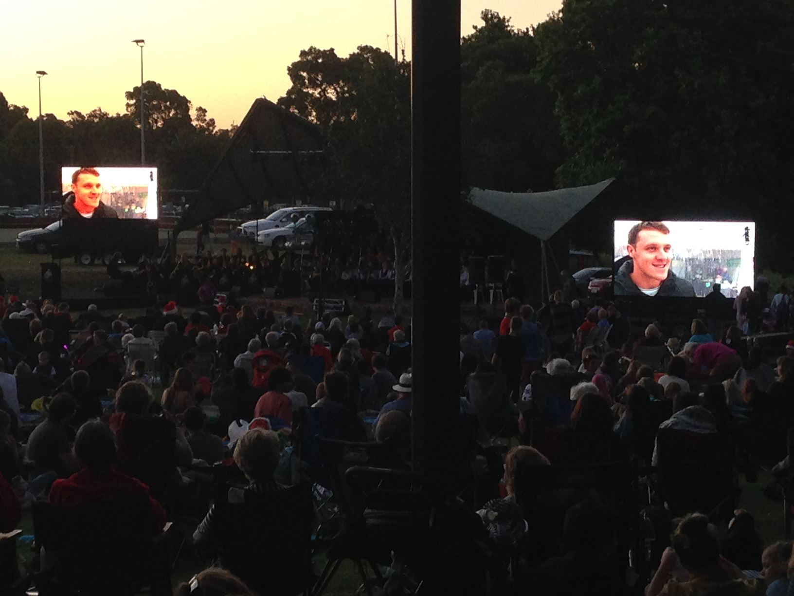 Dual Screens Outdoors at Night